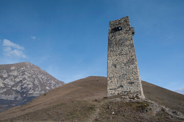 Watchtower of ancient dead city in mountains, Dargavs, Northern Ossetia, Russia