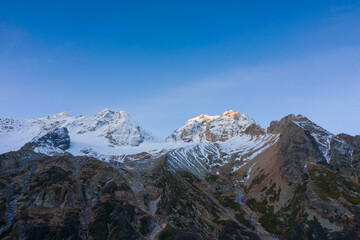 Sunrise scenic autumn mountain landscape with snow peaks, Tuymazinsky glacier, Digor Gorge, Northern Ossetia, Caucasus, Russia