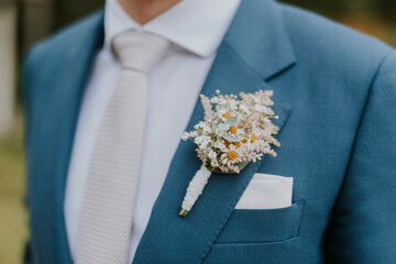 groom with wedding bouquet