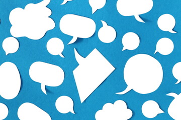 A texture of different white bubbles for thoughts on a blue background.