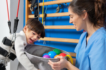 Disabled child is playing, learning and exercising in rehabilitation therapy hospital, Lifestyle of...