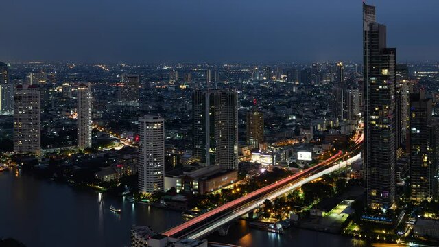 Aerial view of Bangkok city day to night, The city along the Chao Phraya River, Time-lapse 4K video