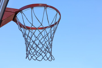 Basketball hoop with net outdoors, space for text