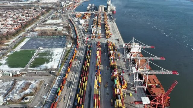 Container are loaded on a ship in the Port Of Montreal City