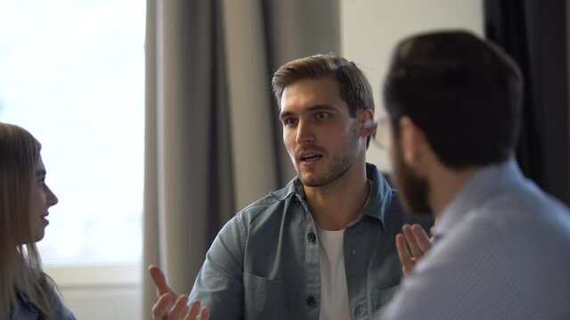 Team leader explaining new project, business people corporate team coworkers having fun talking in office