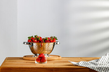 Natural wooden table with a blank background of shadows on the wall 