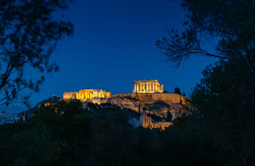 Evening view of the Parthenon Temple at Acropolis hill, in Athen, Greece. The famous old Acropolis is a top landmark of Athens. Scenic view of remains of ancient Athens.