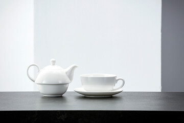 Natural wooden table with a blank background of shadows on the wall 