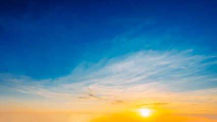 Beautiful Natural Sunset Sunrise. Panoramic Background. Blue, yellow and orange colors of natural sunrise.