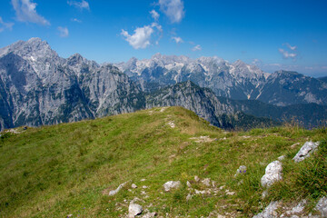 Fototapeta na wymiar View from Debela Peč. Peak in the Julian Alps, Slovenia, august 2020. Horizontal, color photo. With view to hill Triglav.