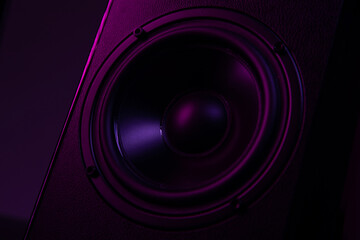 speaker close-up on black background with atmospheric lighting