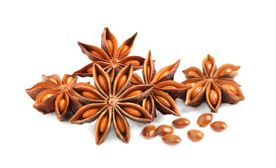 Dry anise stars with seeds on white background