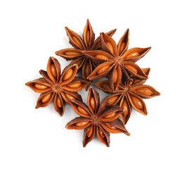 Dry anise stars with seeds on white background, top view