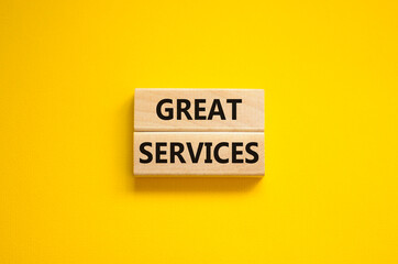 Time to great services symbol. Concept words Great services on wooden blocks on a beautiful yellow background. Business and great services concept. Copy space.