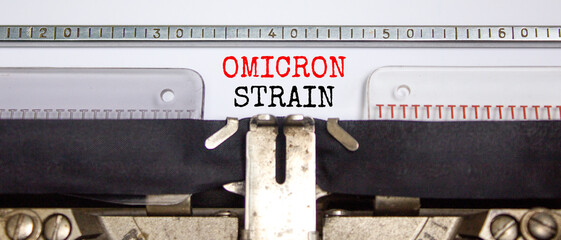 Covid-19 new omicron virus variant symbol. Concept words Omicron strain typed on retro typewriter....
