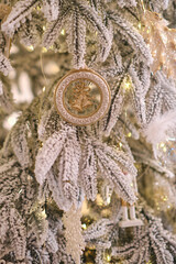 Close up of Christmas tree with white ornaments of baubles
