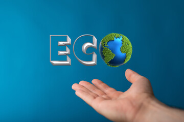 Eco word on the background of green leaves of carrots. plantation