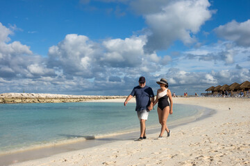 Couple walking on the beach, Bahamas