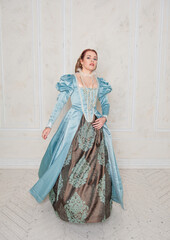 Beautiful young woman in medieval style dress move