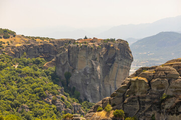 Fototapeta na wymiar Monasteries of Meteora in Kalampaka, Thessaly (Central Greece) buildings on top of giant rock formations 