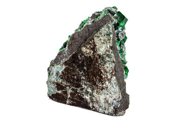 Macro stone garnet mineral, Uvarovite in rock on a white background