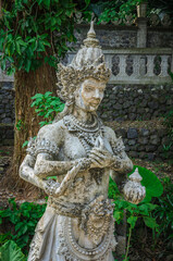 Traditional Balinese stone sculpture in Water Palace Tirta Gangga in Bali island, Indonesia