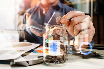 businesswoman hand working with laptop computer, tablet and smart phone in modern office with virtual icon diagram at modernoffice in morning light