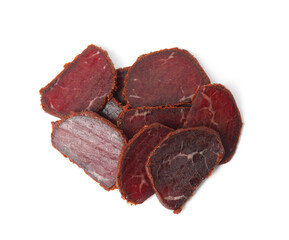 Delicious dry-cured beef basturma slices on white background, top view