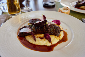 Plate of beef tenderloin with mashed potatoes