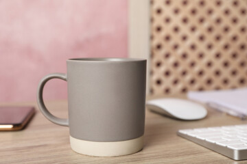 Coffee Break at workplace. Cup of hot drink on wooden table