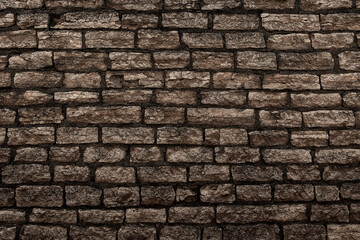 old vintage wall of rough stones as background or web banner