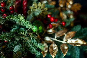 close-up of Christmas toys on the tree. Gold and green