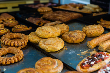 typical Greek sweet street baked goods in a storefront of a Greek pastry.