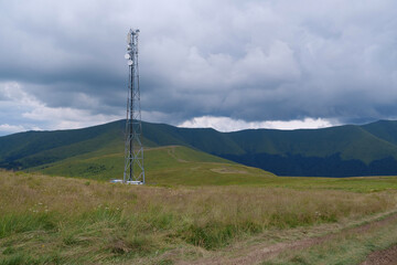 Cell tower and storm clouds in the mountains