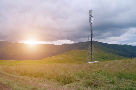 Cell tower and storm clouds in the mountains - Powered by Adobe