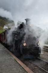 Obraz na płótnie Canvas Furka Dampfzug auf der Furka-Bahnstrecke (Schweiz), Furka steam train on the Furka railway line (Switzerland)