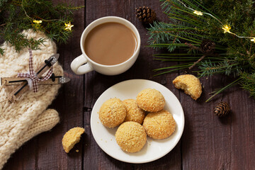Christmas nut cookies Filbertines served with coffee on a background of Christmas decorations.