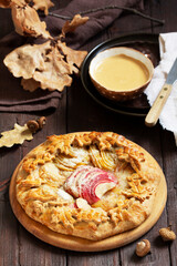 Whole wheat gallet with apple and pear, served with coffee. Rustic style.