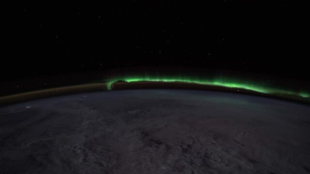 The International Space Station.
Aurora Borealis & Cloudy Skies Over North America.
Source material was provided by NASA. Color correction was done, noise was removed and slowed down.