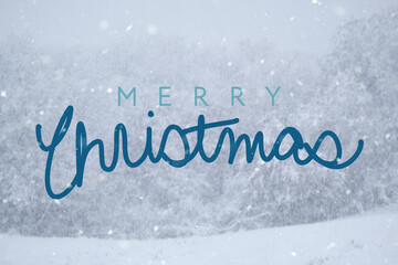 Abstract blurred background of winter snow with Merry Christmas greeting for holiday.