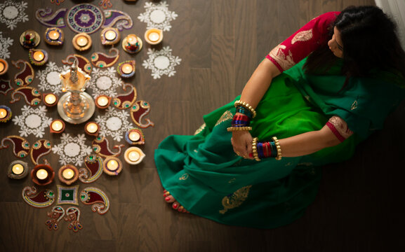 Woman admiring her Diwali decoration 