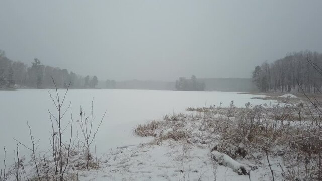 Frozen lake with fog 
