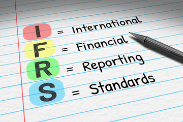 IFRS - International Financial Reporting Standards. Business acronym on note pad.