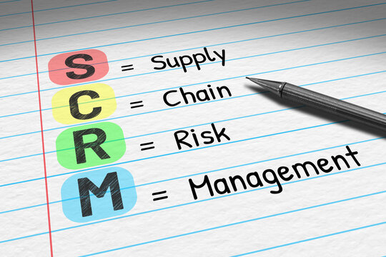 SCRM - Supply Chain Risk Management. Business acronym on note pad.