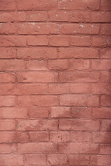 Part of old painted in red color brick wall