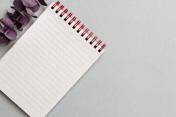 small note pad on gray background