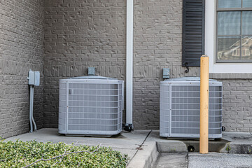 Row of outdoor residential air conditioning units