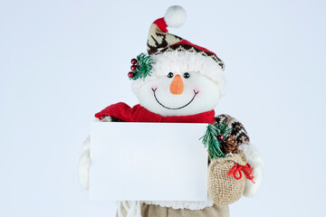 Happy snowman holding blank card stock photo 