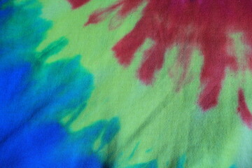 tie dye vivid bright colourful rainbow background swirl with copy space