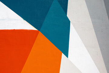 Closeup of colorful blue red gray white urban wall texture. Modern pattern for wallpaper design....